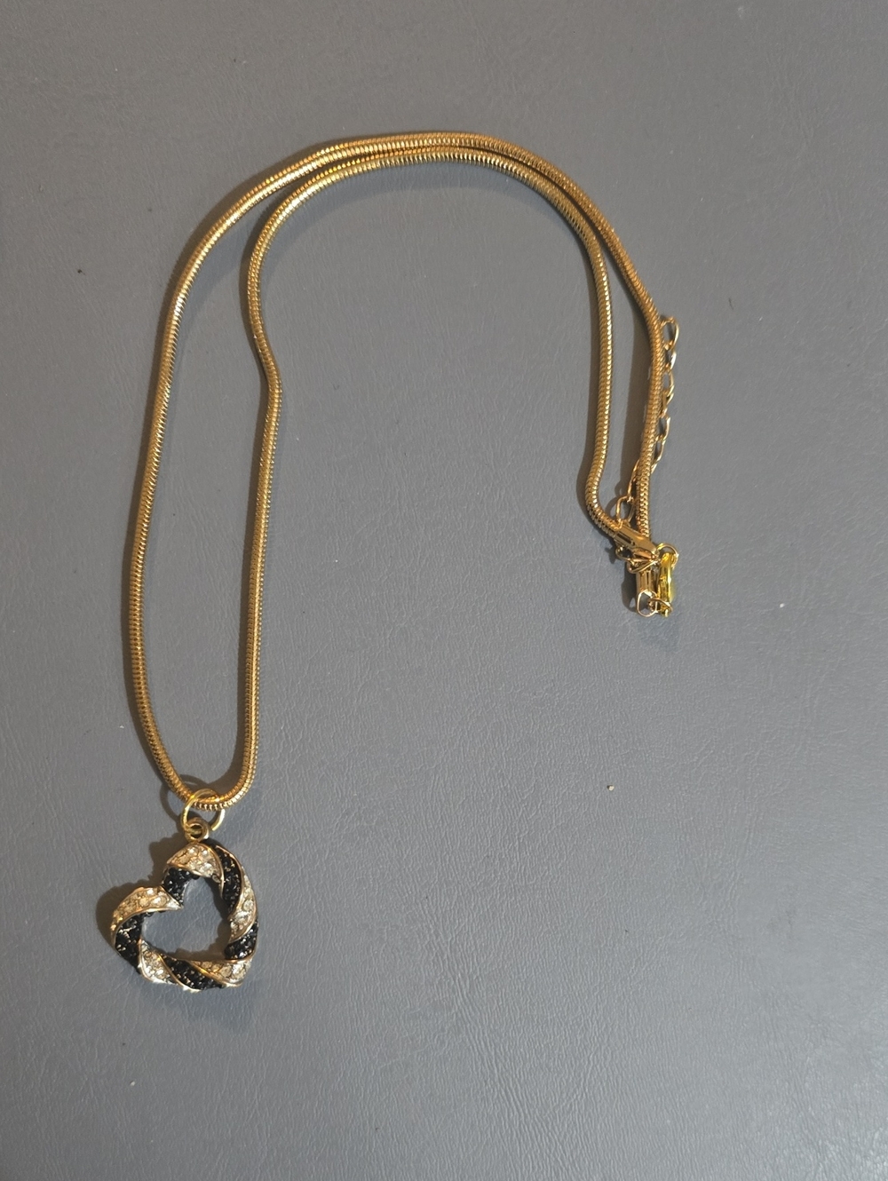 Gold Heart Pendant Necklace with Black and Clear Accents